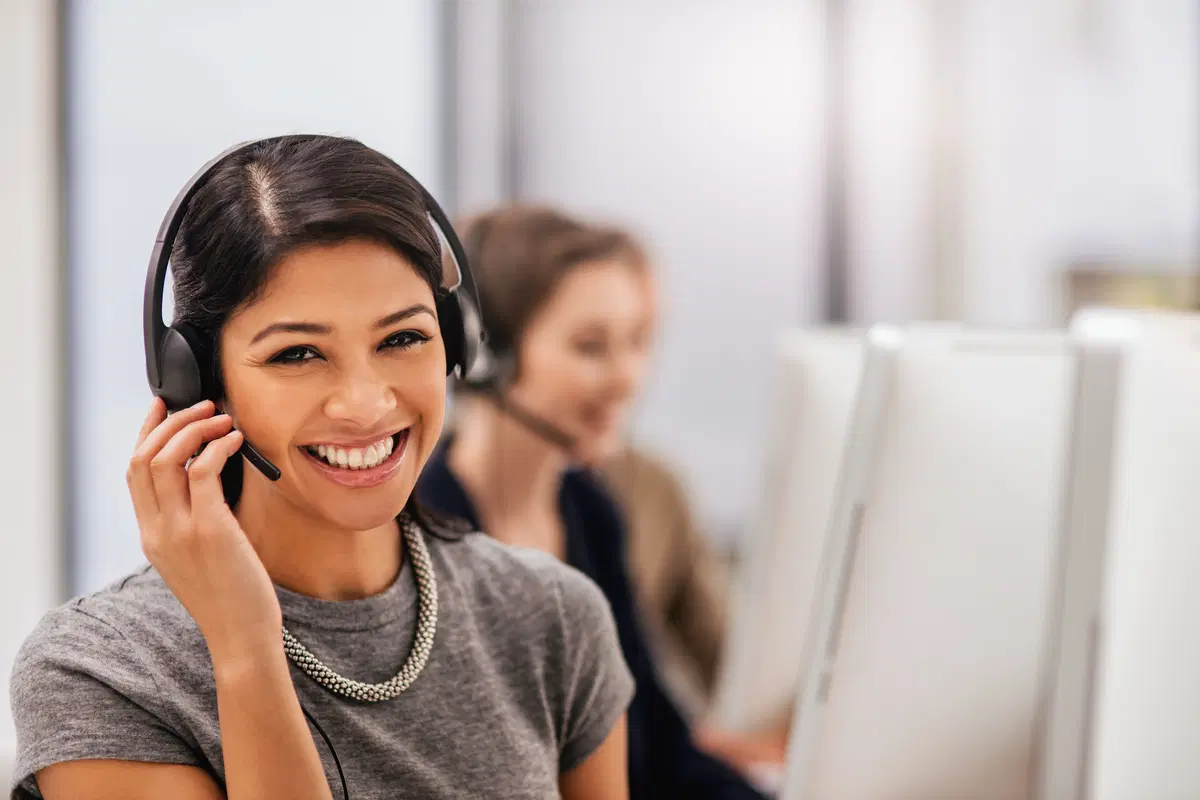 Professional on phone headset — employee benefits enrollment support and guidance