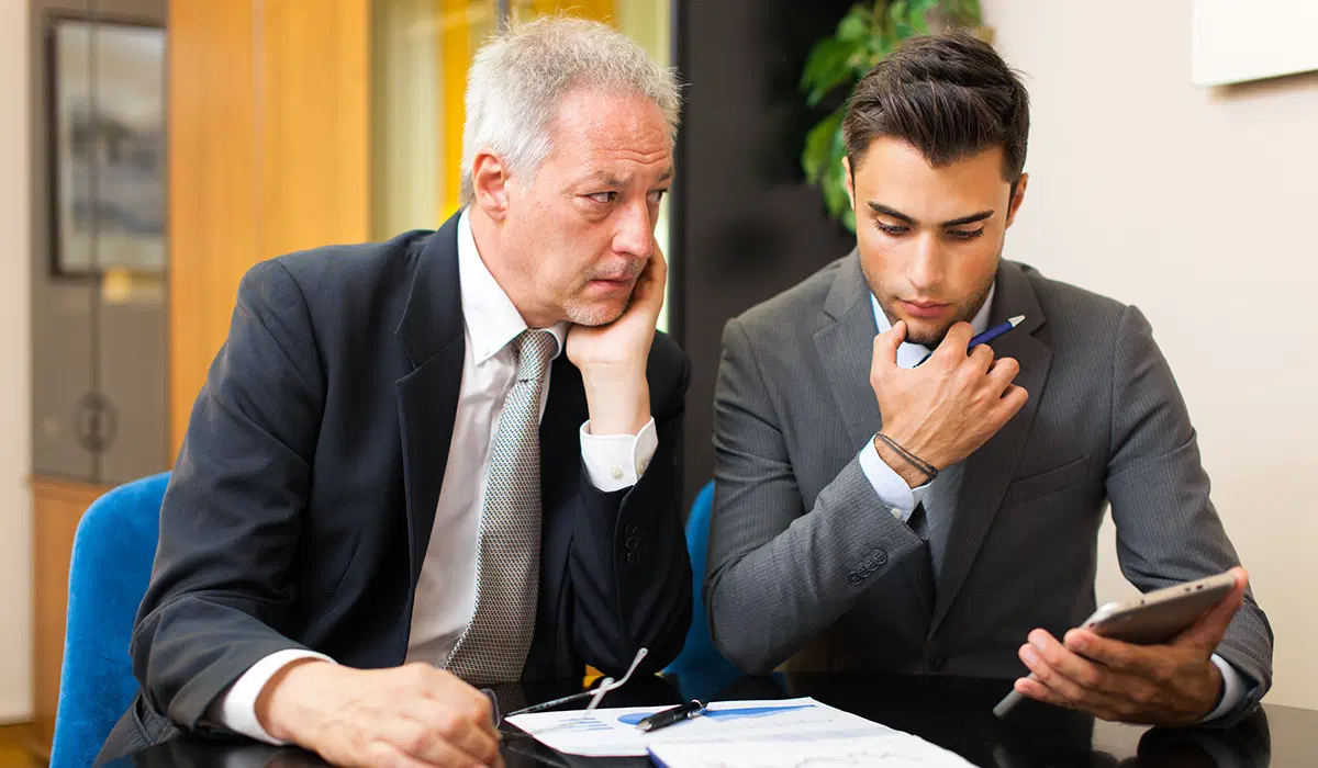 Concerned team in HR meeting — benefits enrollment issue resolution discussion