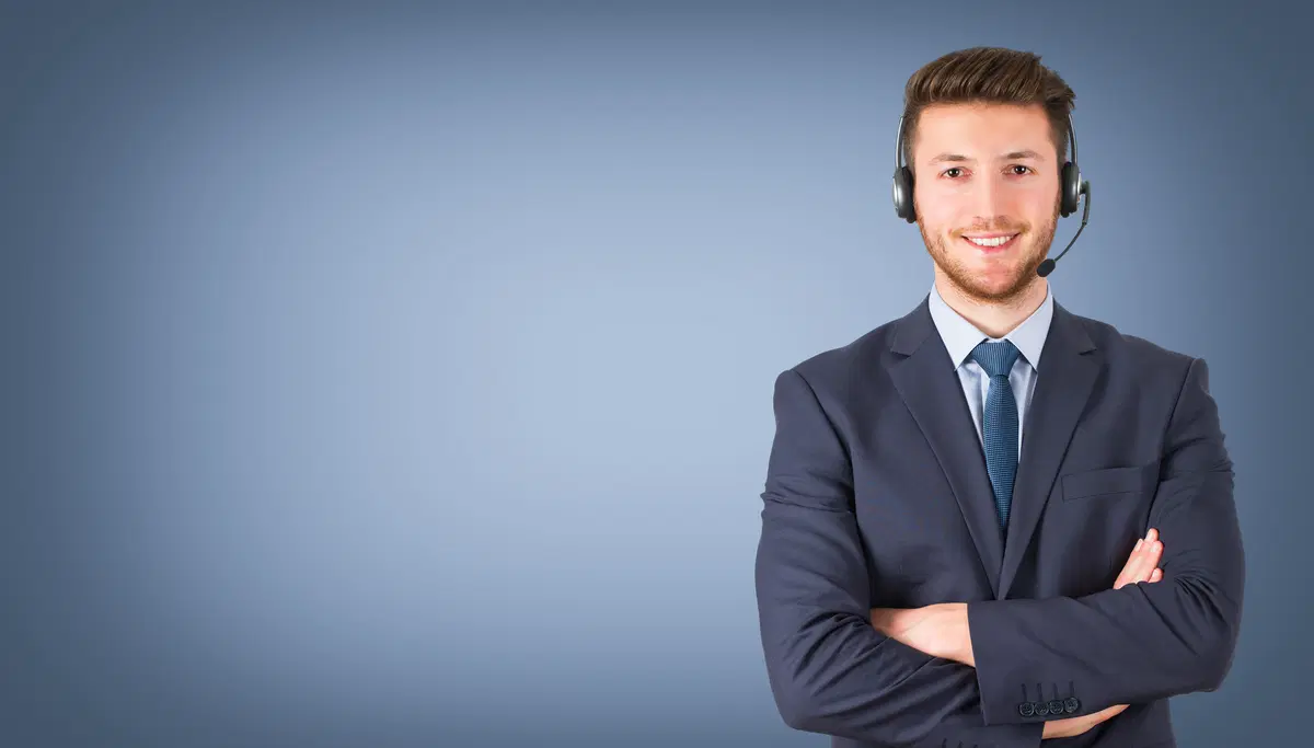 Smiling professional with headset — benefits enrollment help desk support