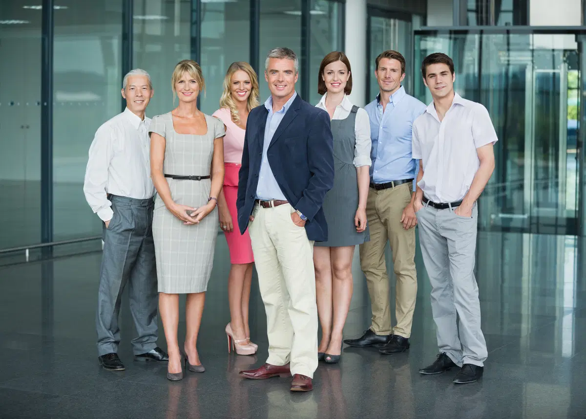Business professionals smiling — benefits Q&A and advisory consultation context
