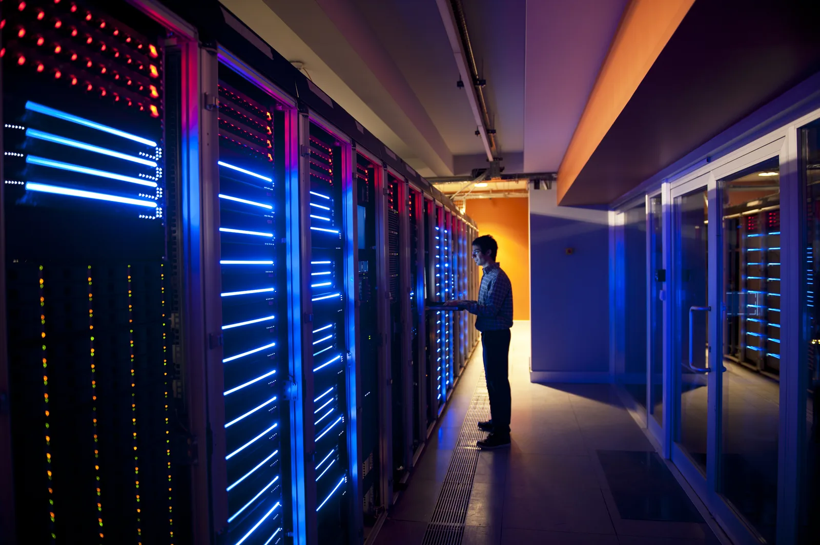 IT professional working in a secure server room facility